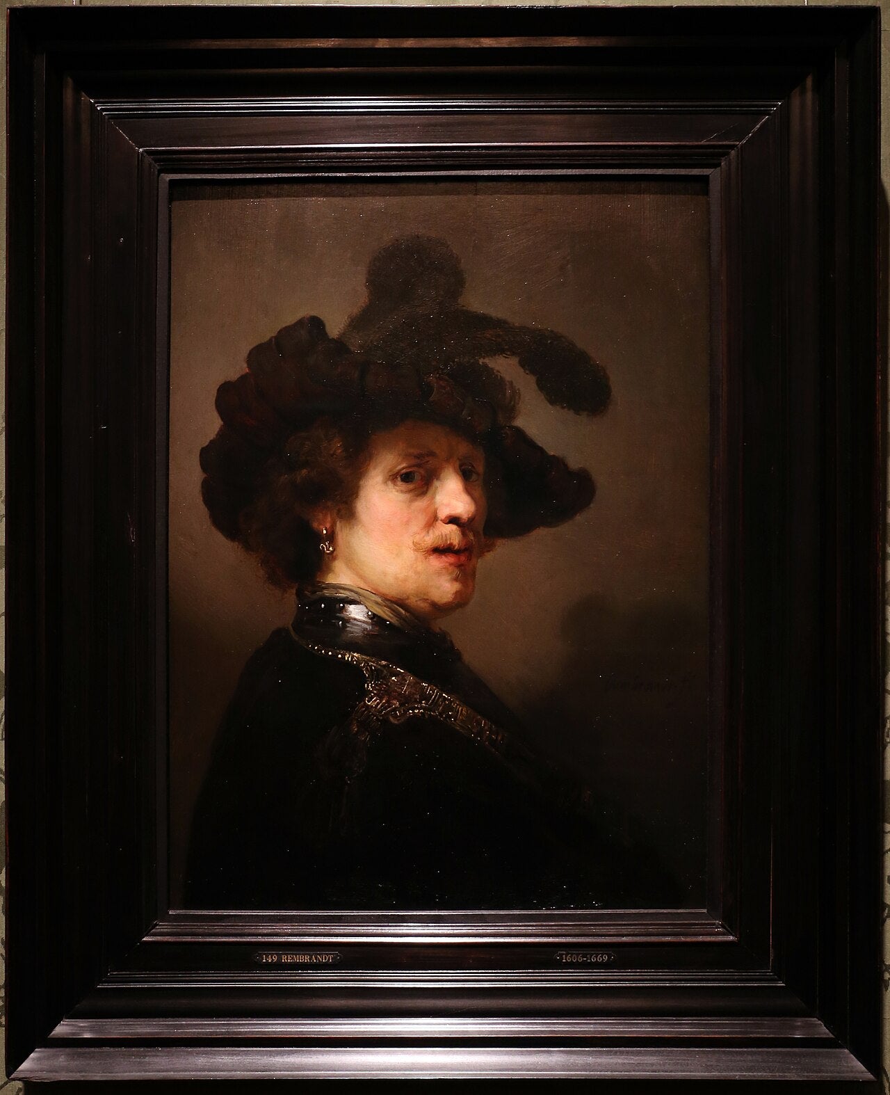 Mężczyzna w kapeluszu z piórami - Rembrandt