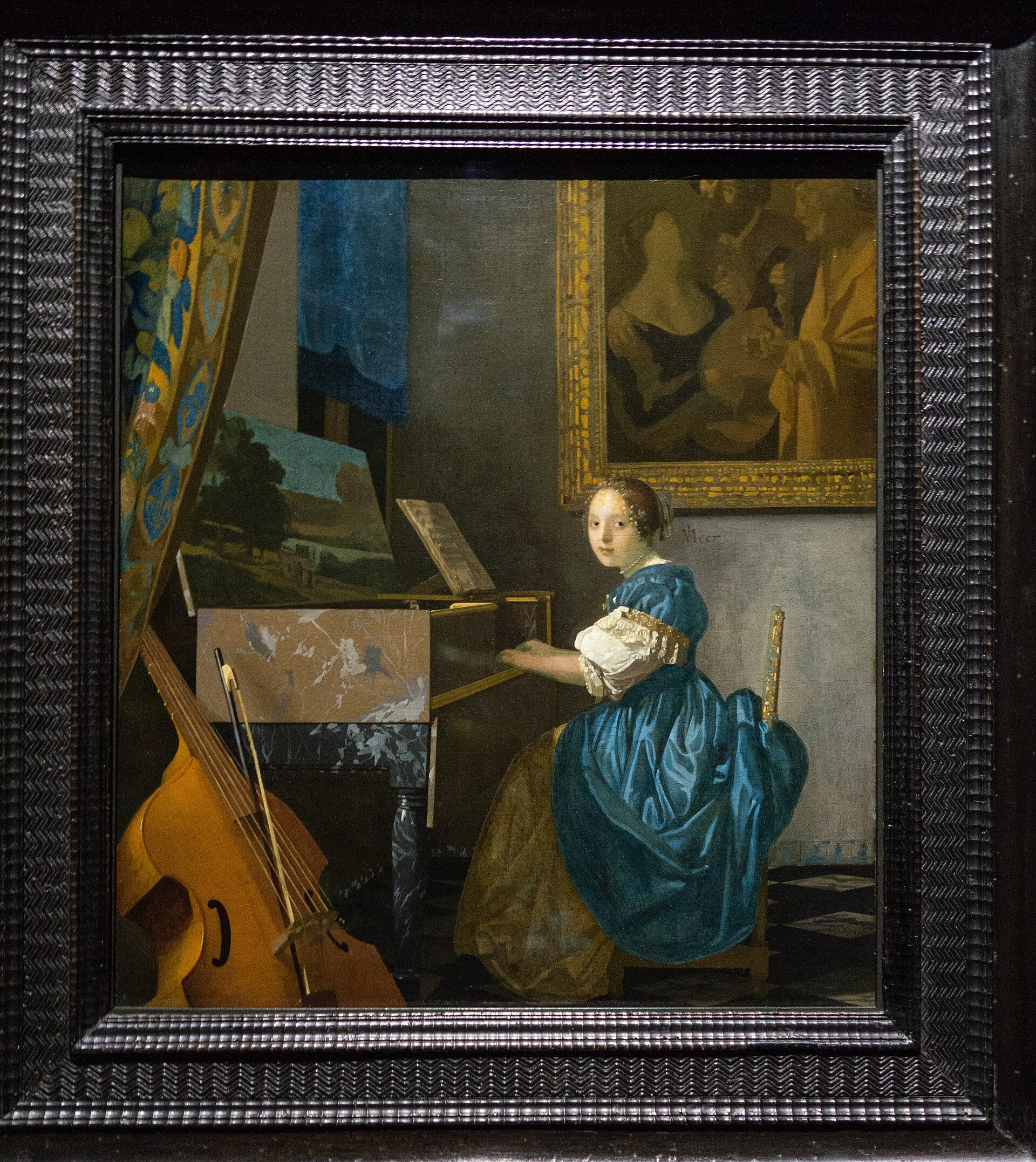 Młoda kobieta grająca na wirginale - Johannes Vermeer