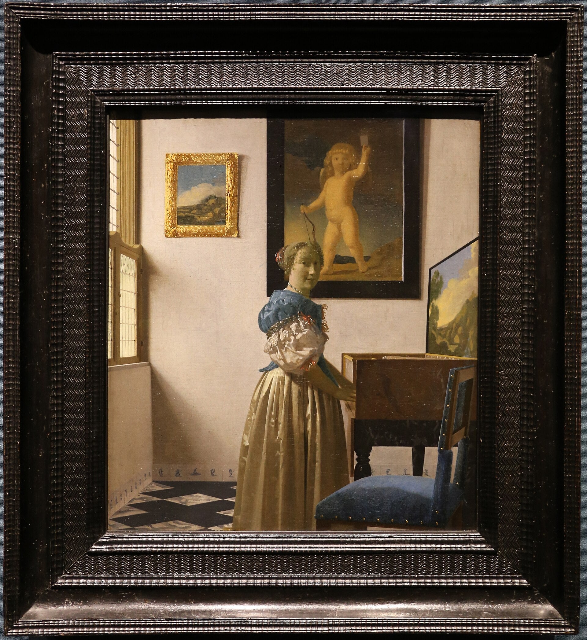 Dama stojąca przy virginale - Johannes Vermeer