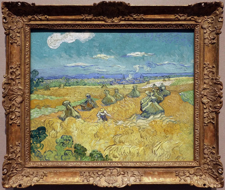 Pole pszenicy z snopkami i żniwiarką - Vincent van Gogh