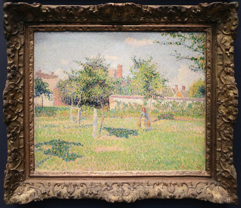 Kobieta w ogrodzie, wiosenne słońce na łące w Éragny - Camille Pissarro