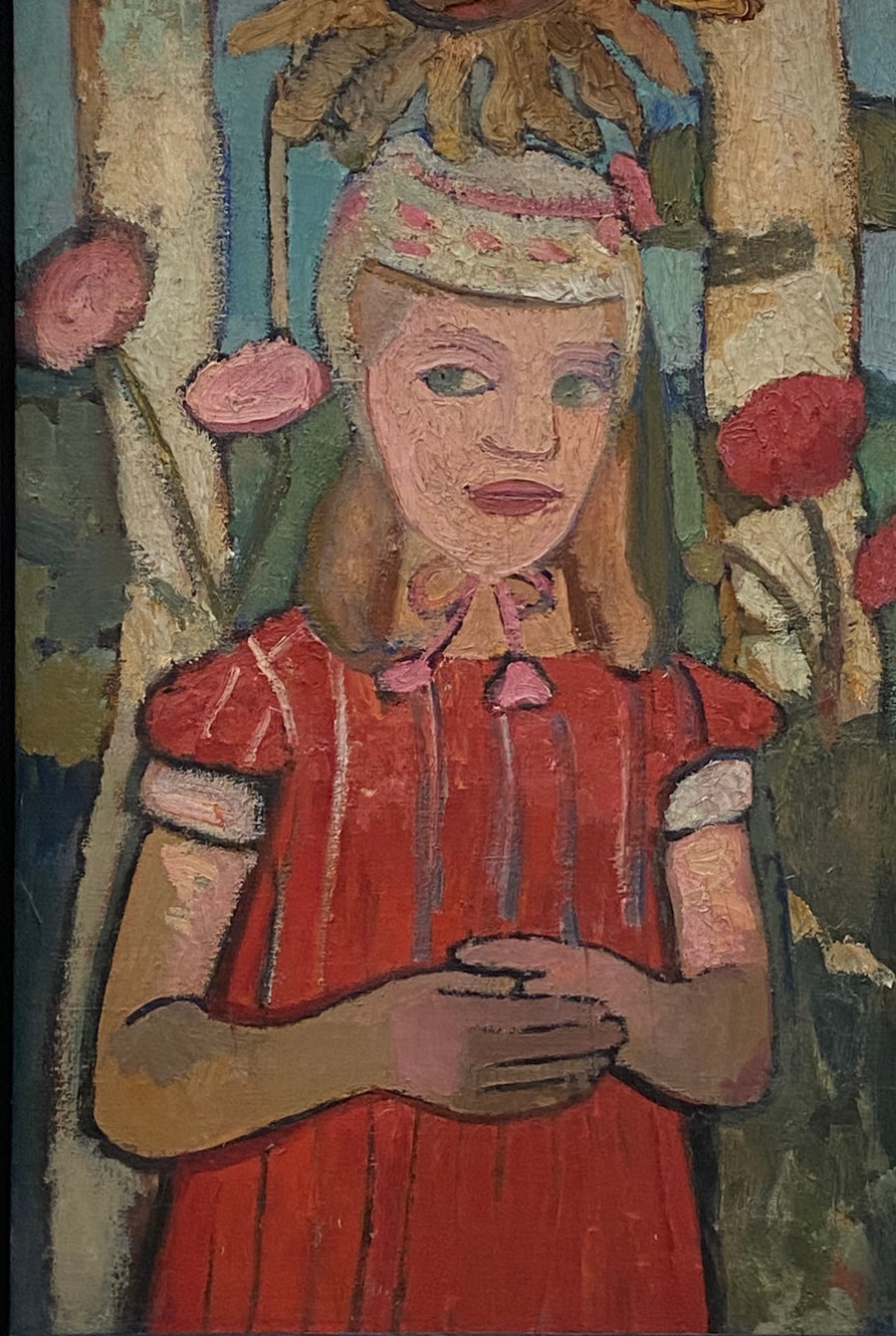 Fille en robe rouge sous un tournesol – Paula Modersohn-Becker