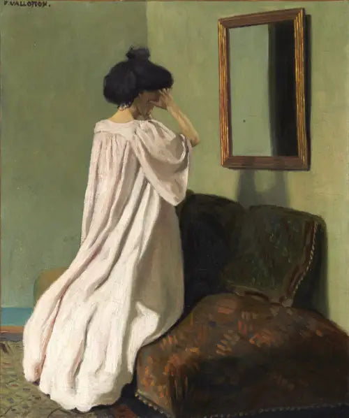 Gabrielle Vallotton klęcząca przed lustrem na kanapie w pracowni przy rue des Belles-Feuilles - Félix Vallotton