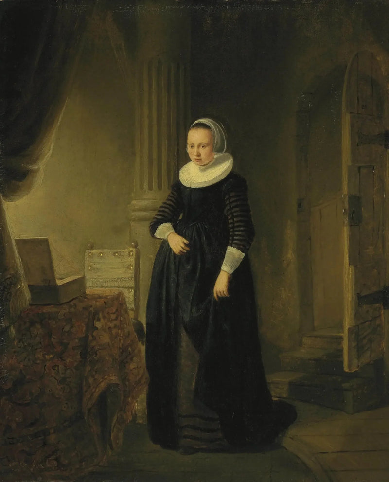 Portret kobiety, stojącej w pełnej postaci w wnętrzu - Rembrandt