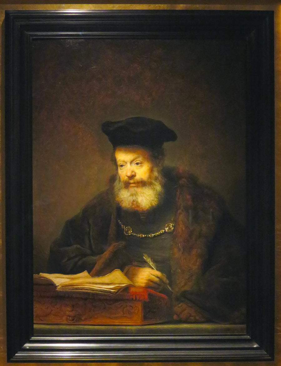 Uczony przy swoim biurku - Rembrandt
