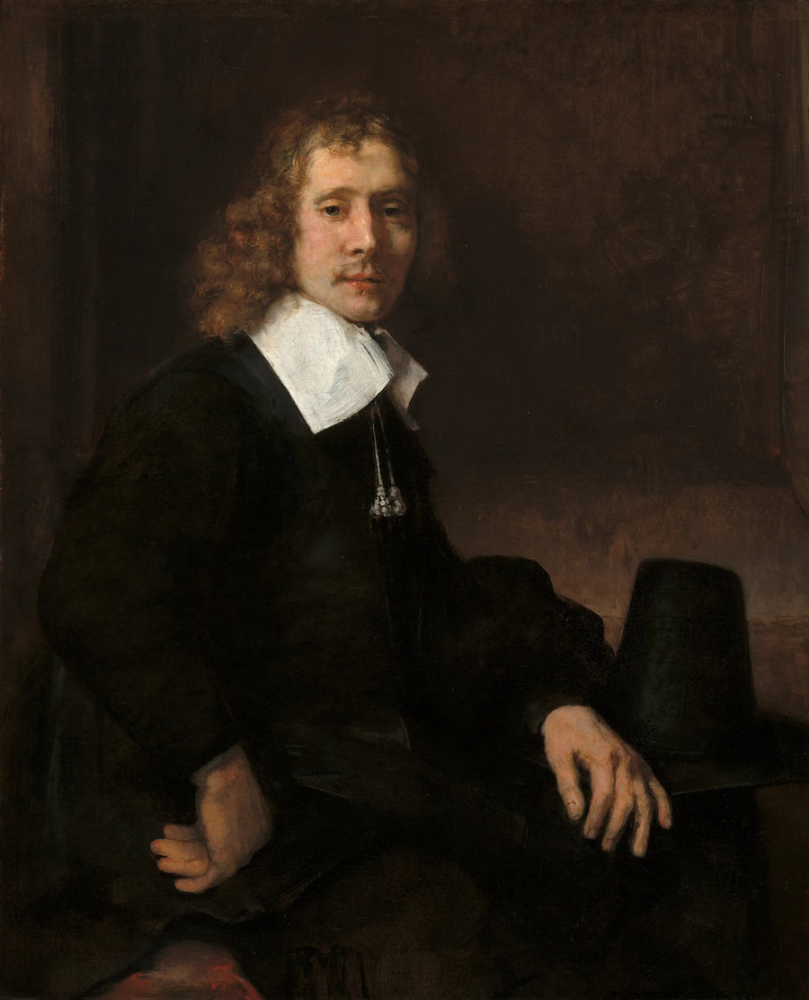 Młody mężczyzna siedzący przy stole (może Govaert Flinck) - Rembrandt